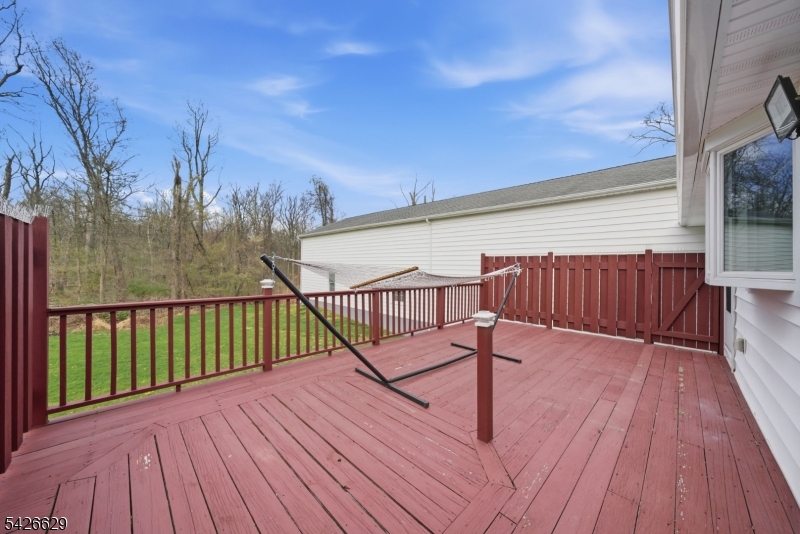 42 Schoolhouse Road Randolph, NJ 07869 - Photo 38 of 49 a view of a balcony with wooden floor and bench