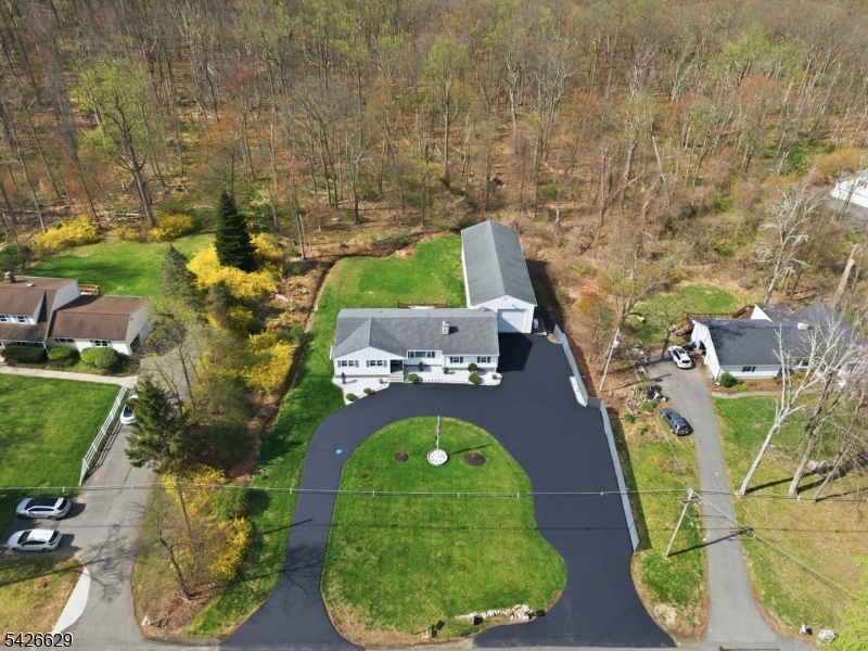 42 Schoolhouse Road Randolph, NJ 07869 - Photo 44 of 49 an aerial view of a house with a swimming pool