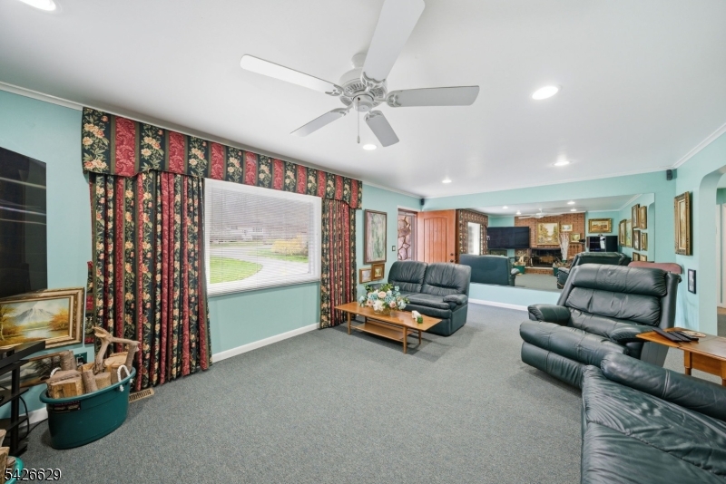 42 Schoolhouse Road Randolph, NJ 07869 - Photo 5 of 49 a living room with furniture and a flat screen tv
