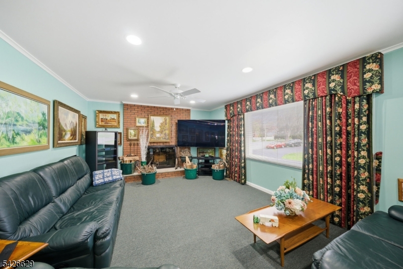 42 Schoolhouse Road Randolph, NJ 07869 - Photo 6 of 49 a living room with furniture and a flat screen tv