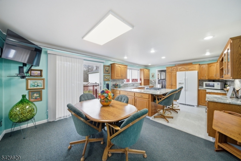 42 Schoolhouse Road Randolph, NJ 07869 - Photo 8 of 49 a workspace with furniture and a kitchen
