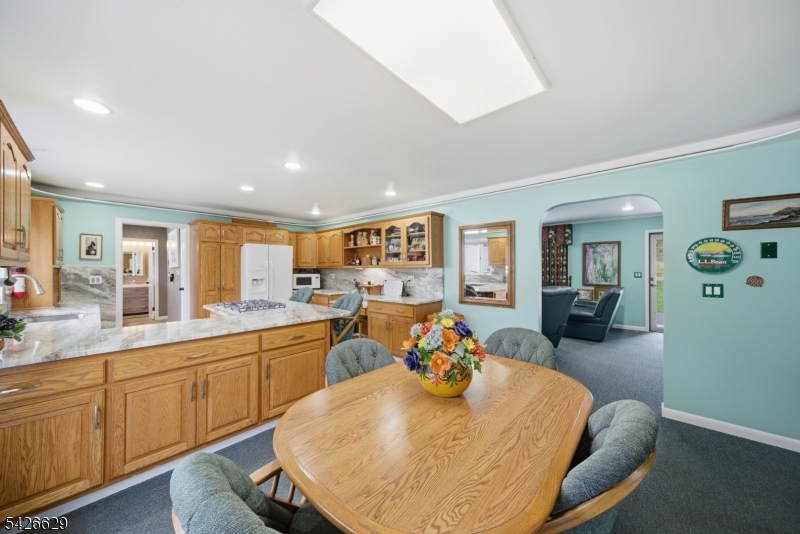 42 Schoolhouse Road Randolph, NJ 07869 - Photo 9 of 49 a view of a dining room with furniture and wooden floor