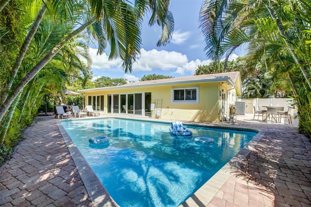 a view of a house with a swimming pool