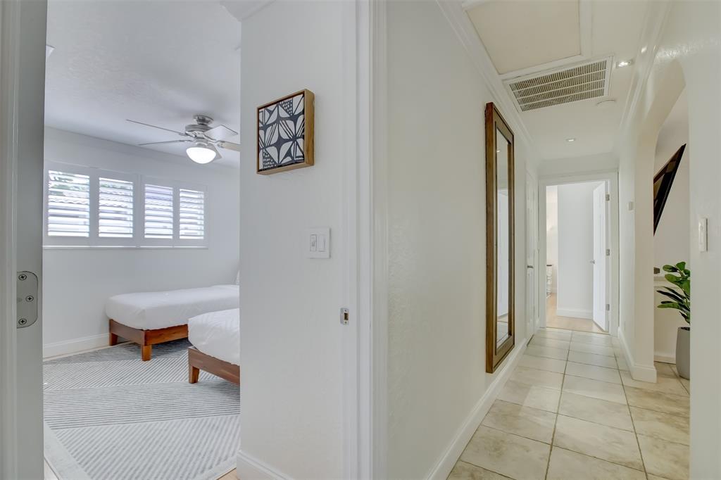 2600 North Riverside Drive Pompano Beach, FL 33062 - Photo 21 of 25 a view of a hallway with workspace and a window