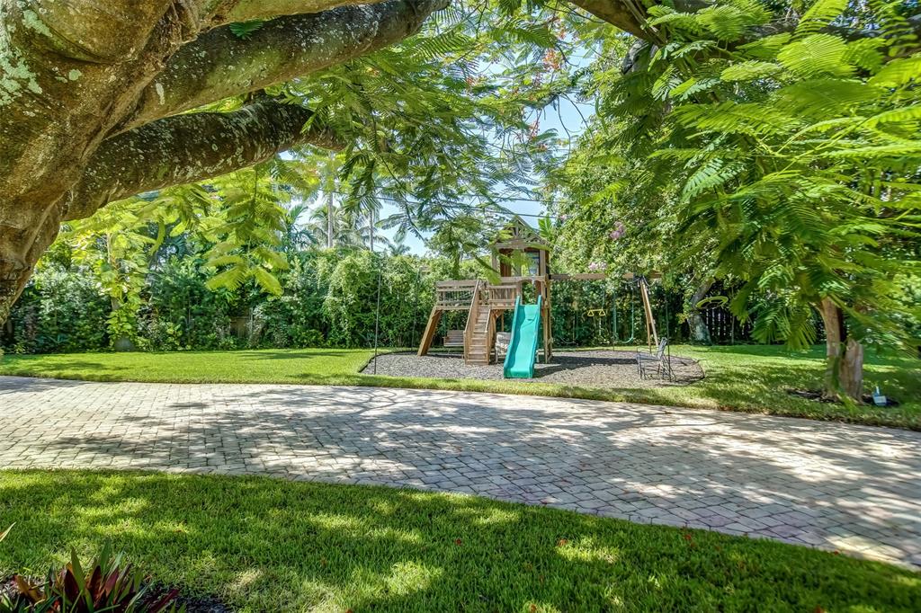 2600 North Riverside Drive Pompano Beach, FL 33062 - Photo 24 of 25 a view of a yard with plants and trees