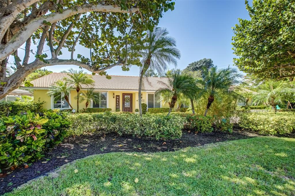 2600 North Riverside Drive Pompano Beach, FL 33062 - Photo 5 of 25 a front view of a house with a yard