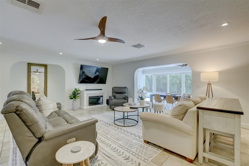 2600 North Riverside Drive Pompano Beach, FL 33062 - Photo 6 of 25 a living room with furniture and a large window