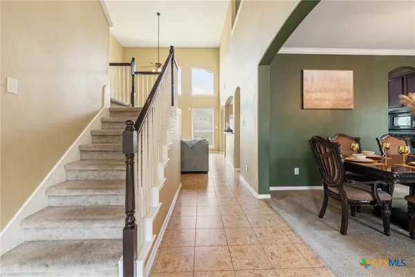 a view of a hallway with seating area