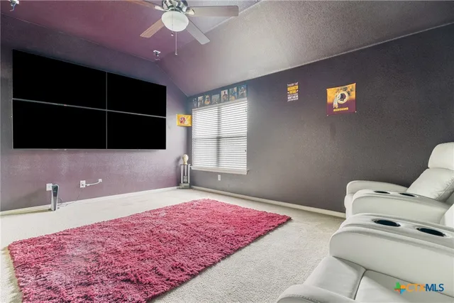 a spacious bedroom with a bed and a window