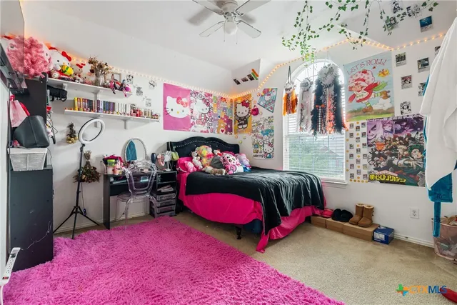 a bedroom with furniture and a bed