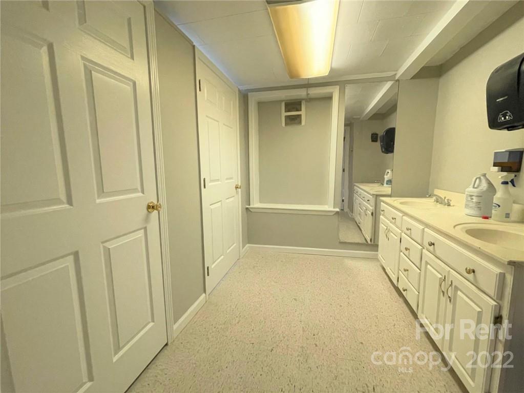 201 West Morgan Street, Unit B Wadesboro, NC 28170 - Photo 14 of 14 a bathroom with a tub sink and mirror