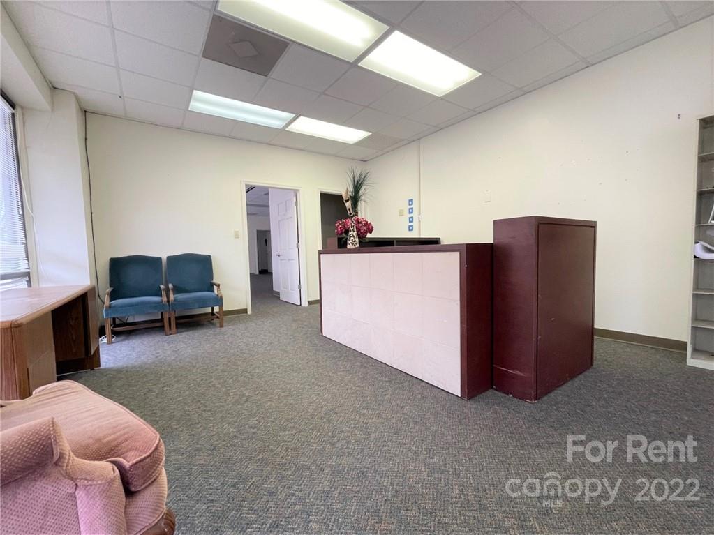 201 West Morgan Street, Unit B Wadesboro, NC 28170 - Photo 3 of 14 a living room with furniture and a lamp