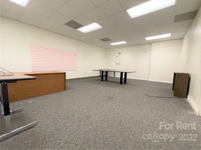 a view of game room with windows