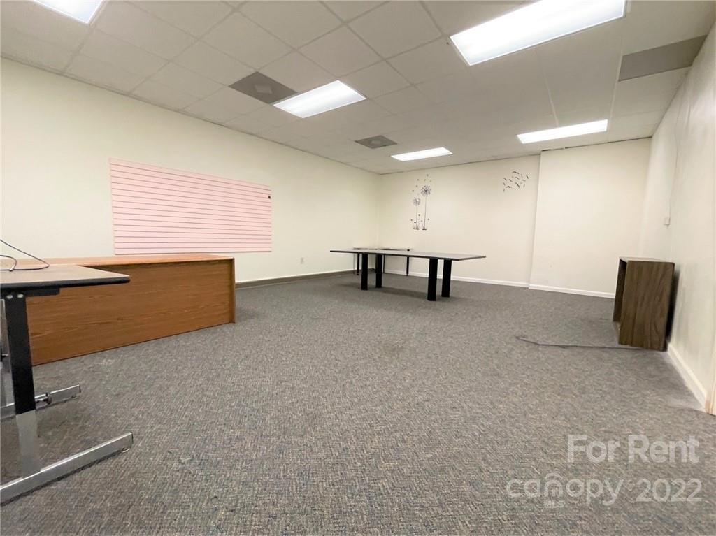 201 West Morgan Street, Unit B Wadesboro, NC 28170 - Photo 7 of 14 a view of game room with windows