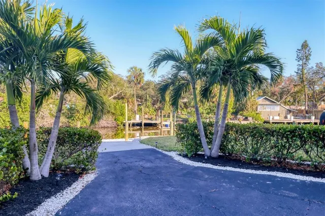 a view of a lake with boats and trees in the background