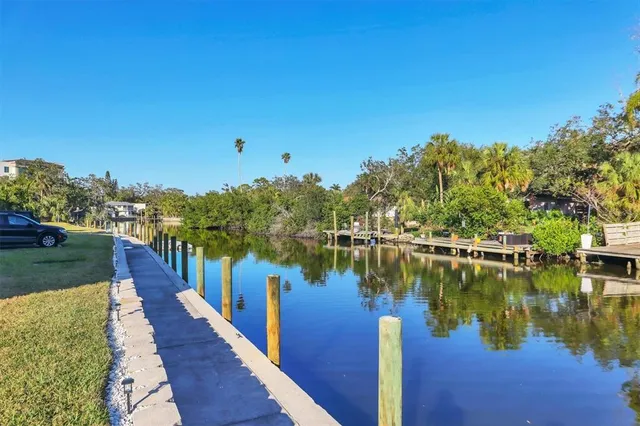 a view of a lake with a house in background