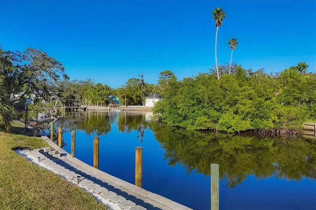 a view of a lake with a house in the background
