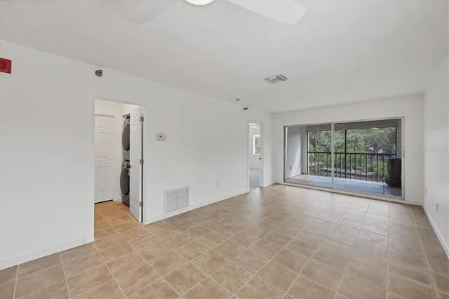 a view of an empty room with a balcony