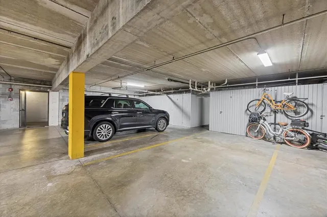 a view of a balcony with floor to ceiling window and wooden fence