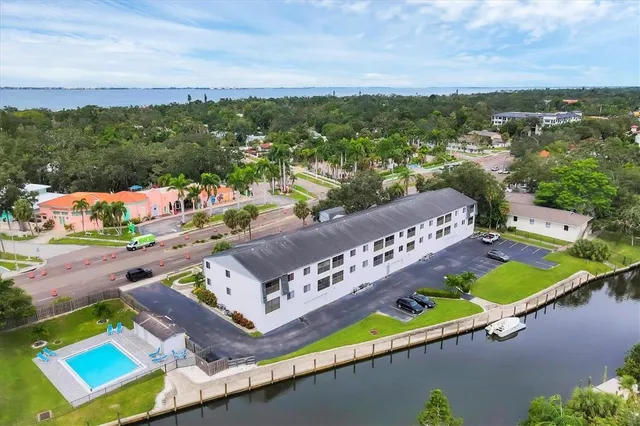 an aerial view of house with yard swimming pool and outdoor seating