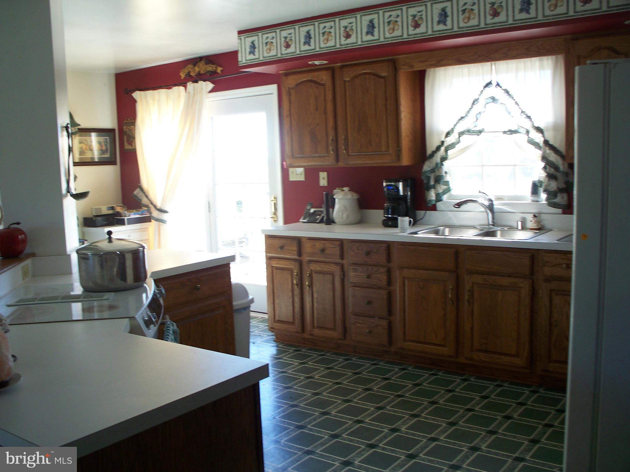 11862 Good Intent Road Keymar, MD 21757 - Photo 14 of 24 a kitchen with a sink a window and cabinets