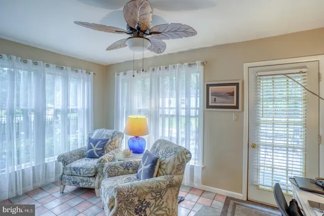 a living room with furniture and a window