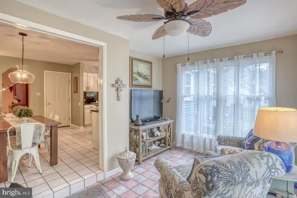 a bedroom with furniture and a chandelier
