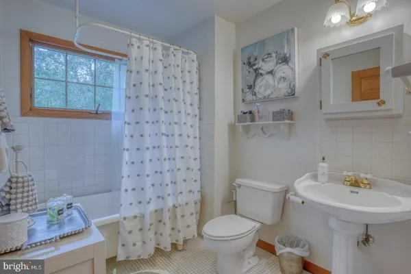 a bedroom with a bed and dresser