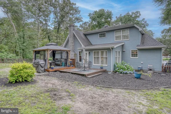 a view of a two chairs in the patio