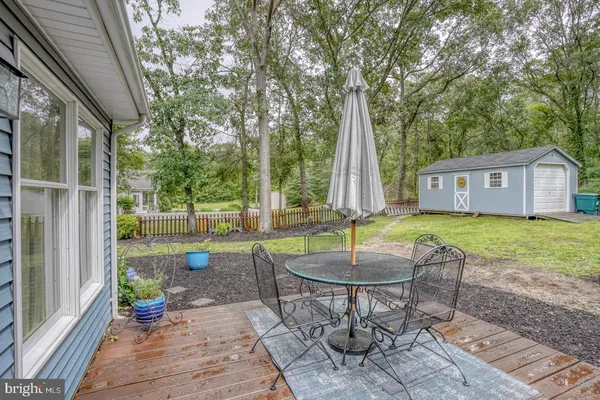 a front view of house with a garden and patio