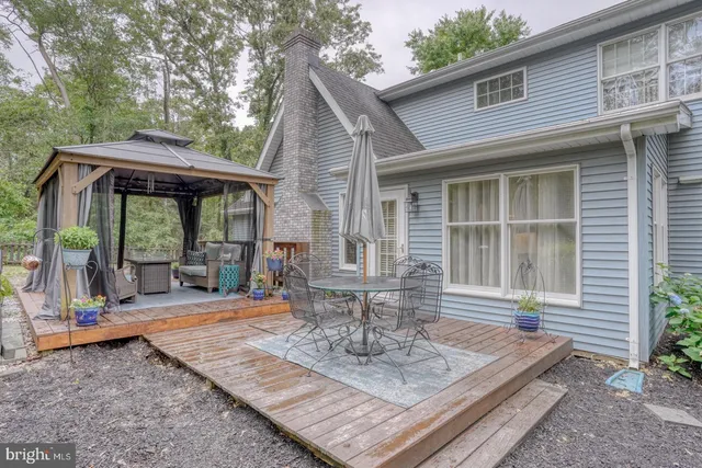 a view of a big yard with potted plants
