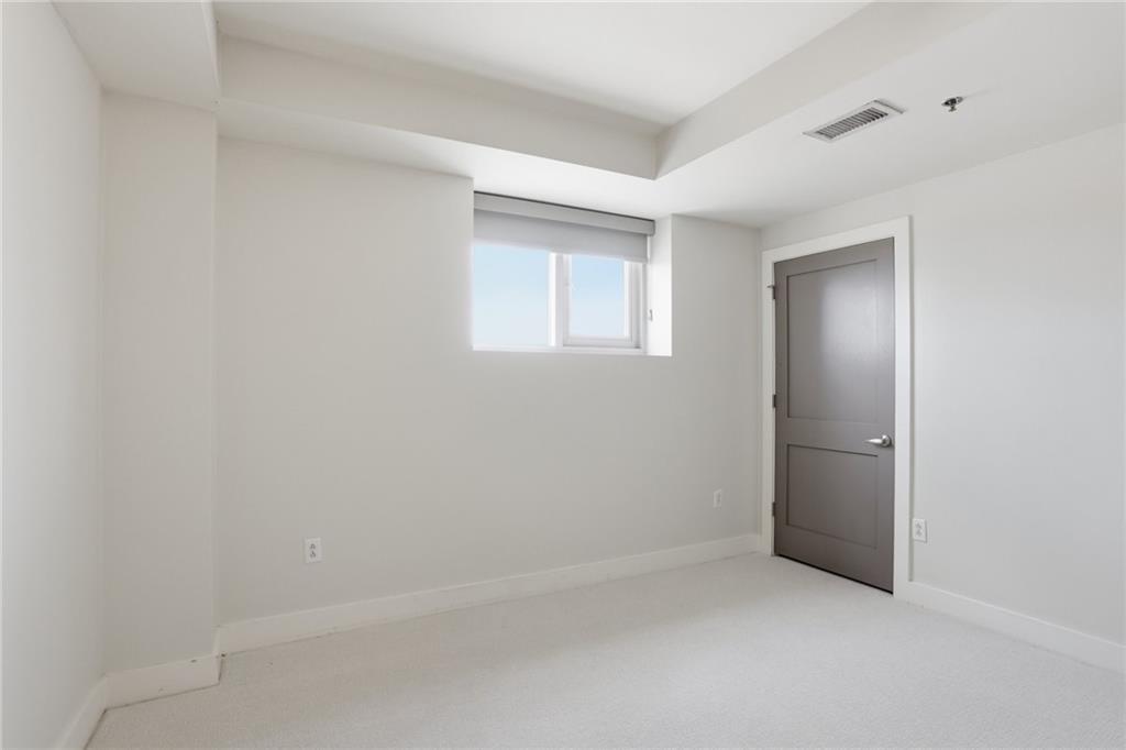 1100 Howell Mill Road Northwest, Unit 608 Atlanta, GA 30318 - Photo 24 of 37 a view of an empty room with a window