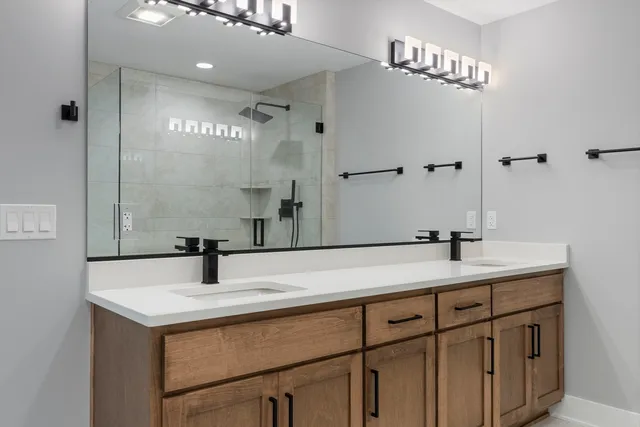 a bathroom with a sink and a mirror