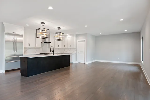 a kitchen with a sink cabinets and counter top space