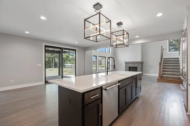 a kitchen with a table and chairs