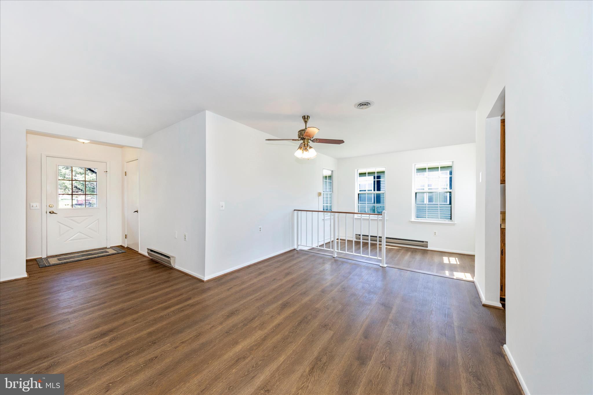 5738 Box Elder Court Frederick, MD 21703 - Photo 9 of 50 wooden floor in an empty room with a window