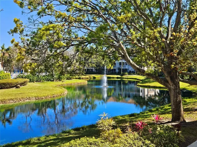 a view of a lake with a house in the background