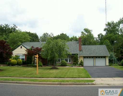 9 Flower Road Somerset, NJ 08873 - Photo 1 of 8 a front view of a house with a yard
