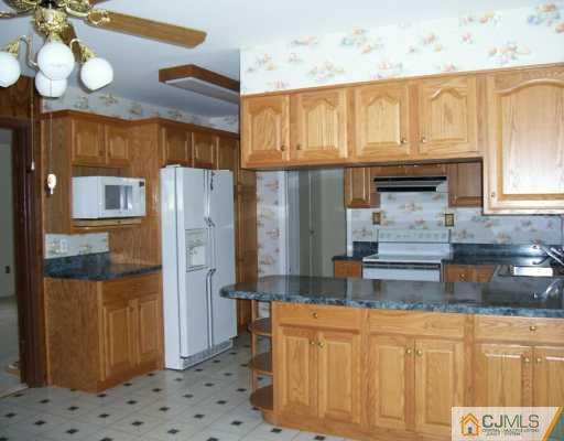 9 Flower Road Somerset, NJ 08873 - Photo 2 of 8 a kitchen with stainless steel appliances granite countertop a refrigerator a sink and dishwasher