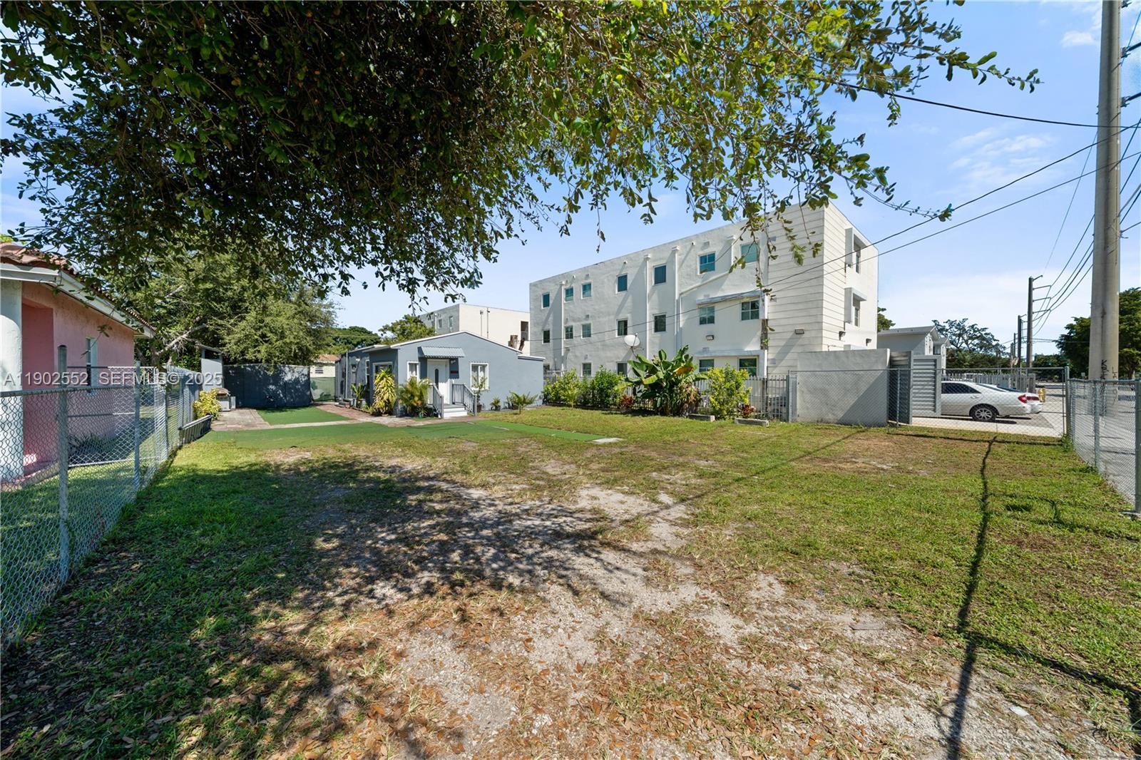 1257 Northwest 58th Street Miami, FL 33142 - Photo 1 of 27 a view of a house with a yard
