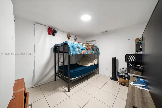 a bedroom with furniture and a gate