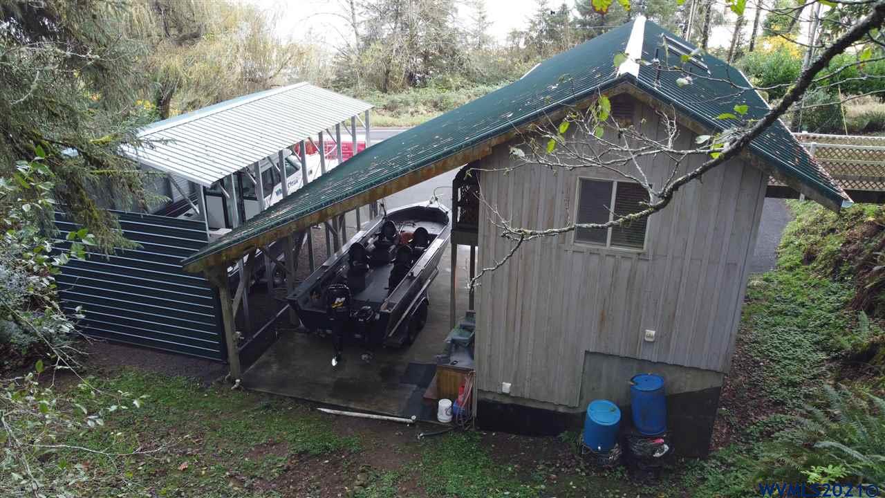 1690 Bayocean Road Northwest Tillamook, OR 97141 - Photo 6 of 25 a view of a house with a yard