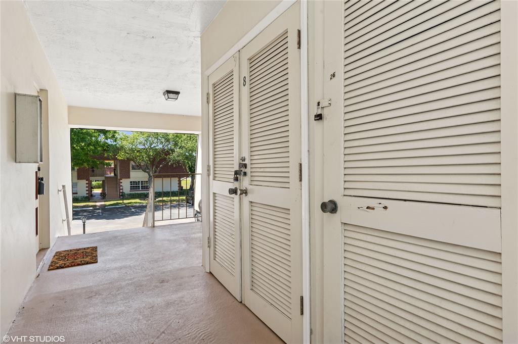 2011 Northeast 32nd Court, Unit 26 Lighthouse Point, FL 33064 - Photo 13 of 13 a view of a room with a porch