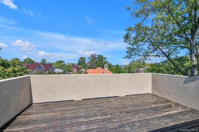 a view of a brick house with a large window