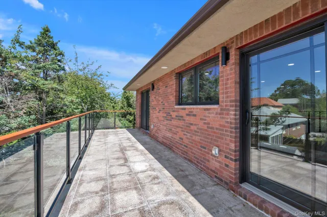 a view of backyard with wooden fence