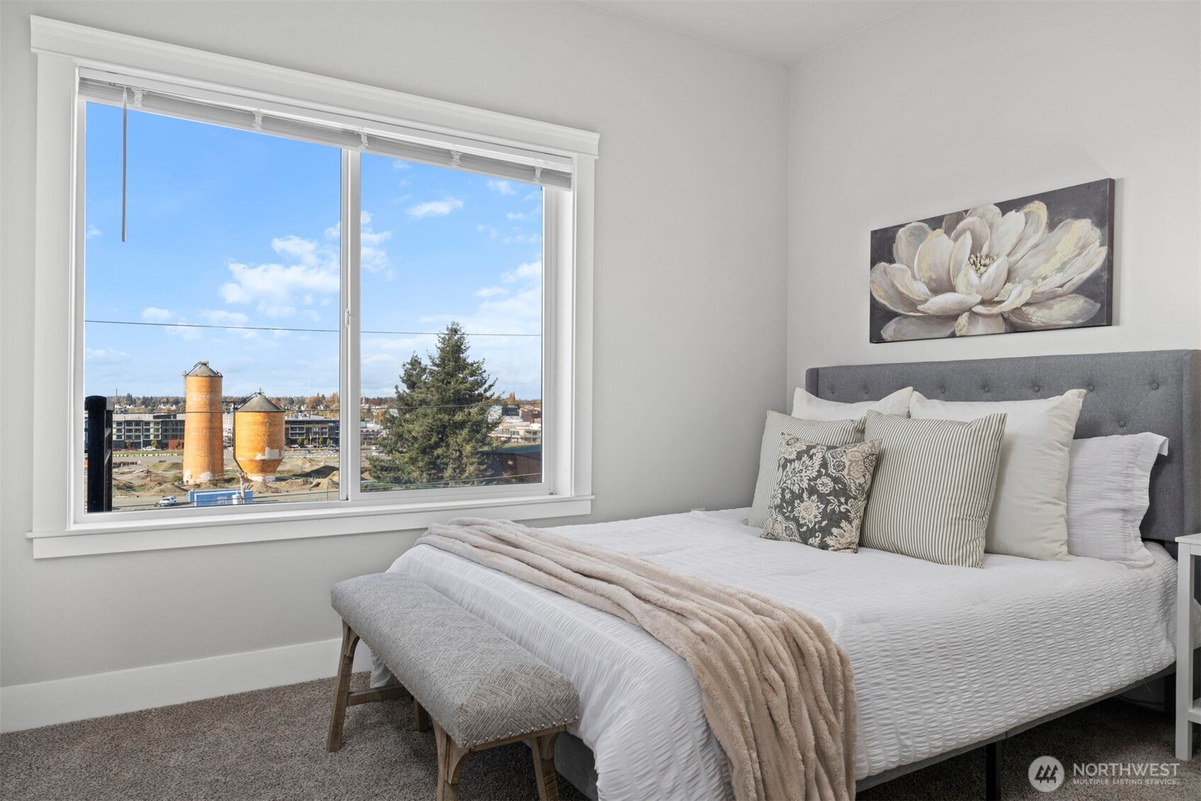 1015 Railroad Avenue, Unit 418 Bellingham, WA 98225 - Photo 13 of 23 a bedroom with a bed and a painting on the wall