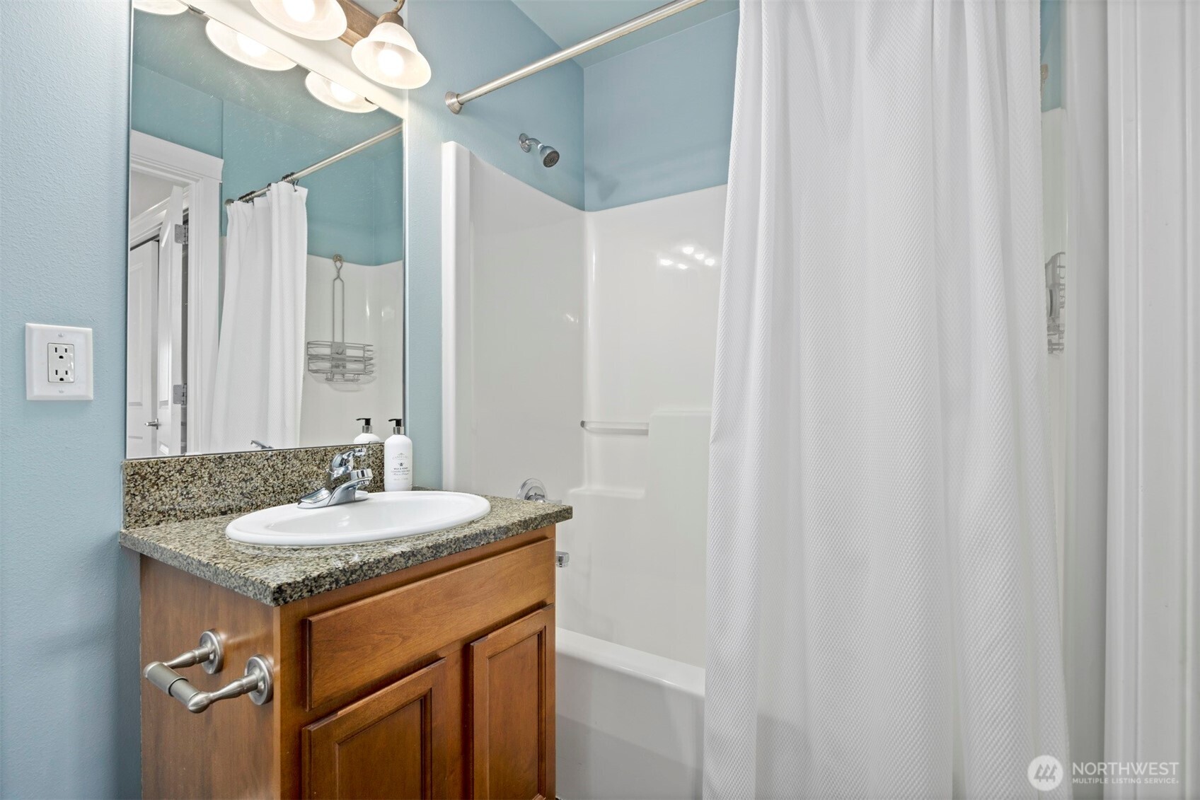 1015 Railroad Avenue, Unit 418 Bellingham, WA 98225 - Photo 16 of 23 a bathroom with a sink and a mirror