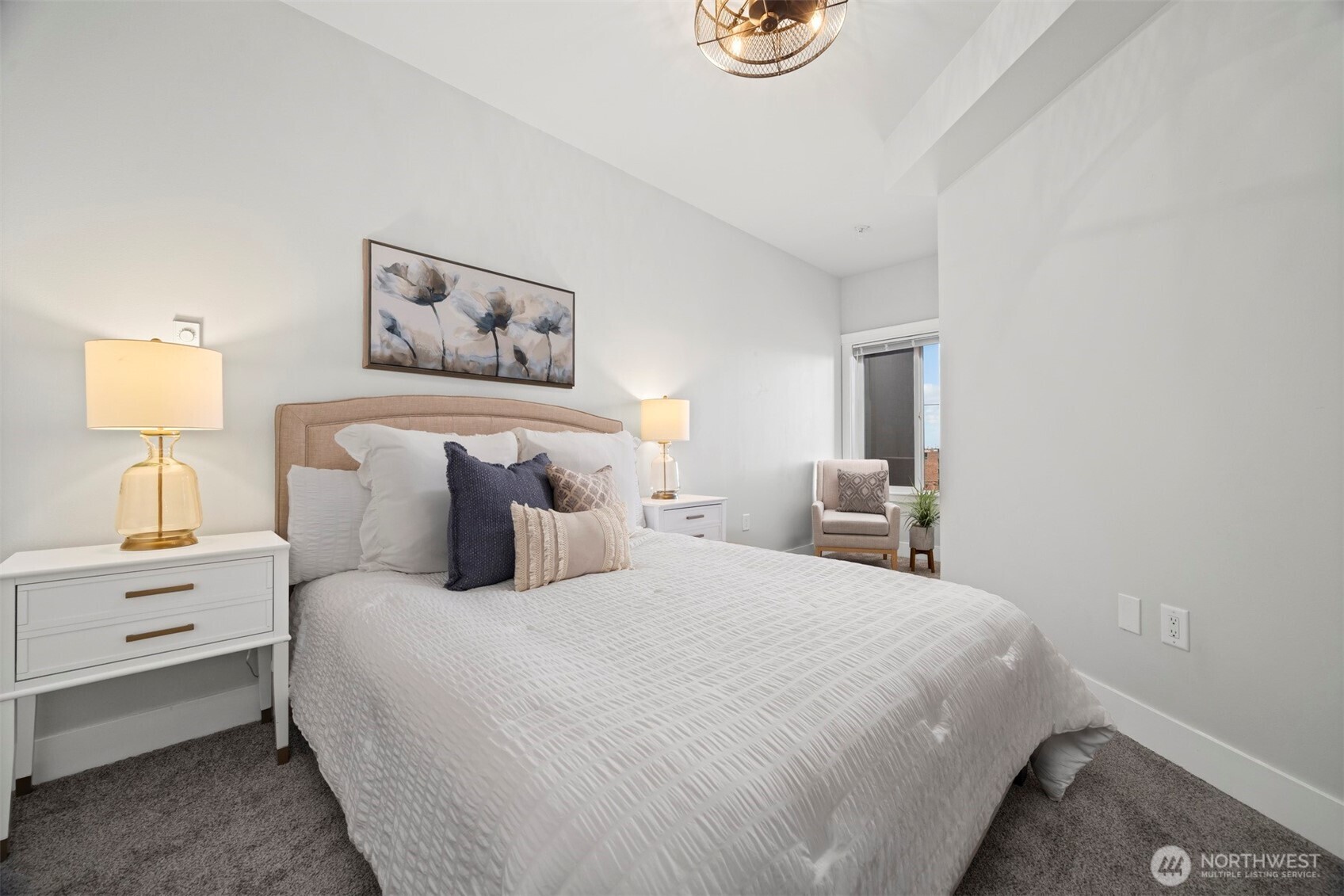 1015 Railroad Avenue, Unit 418 Bellingham, WA 98225 - Photo 17 of 23 a bedroom with bed and painting on the wall