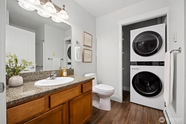 a bathroom with a toilet a sink and a mirror