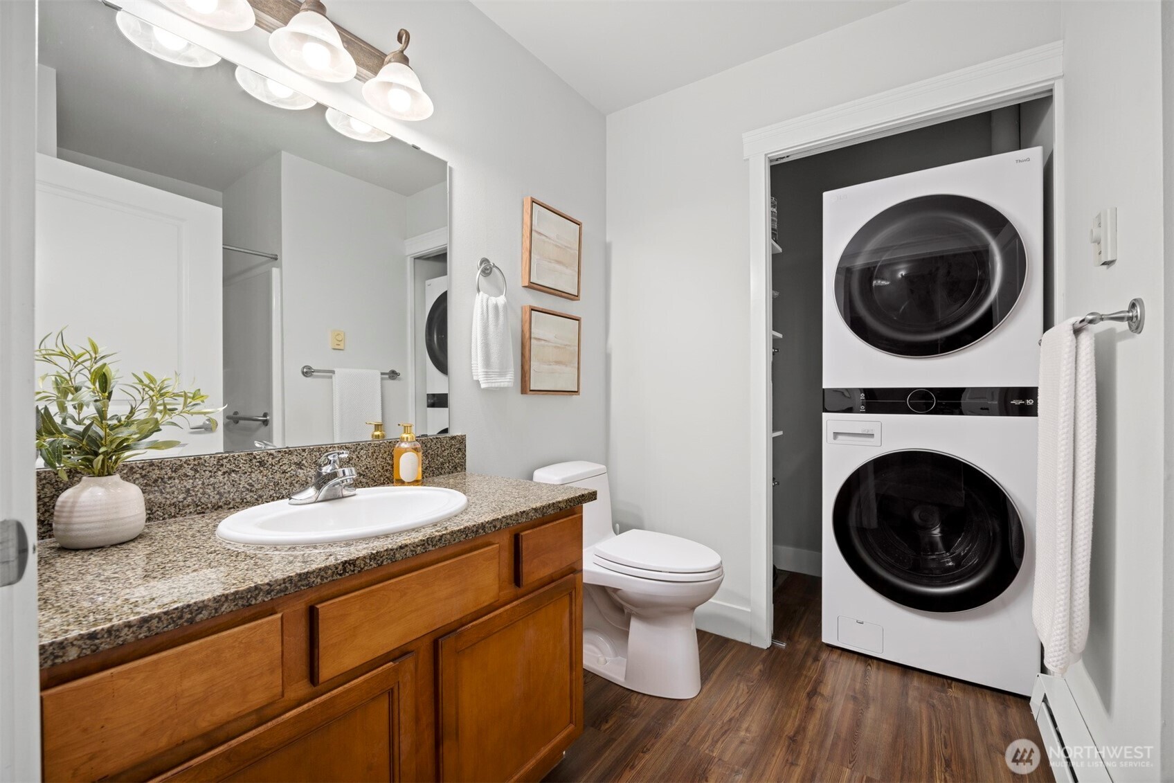 1015 Railroad Avenue, Unit 418 Bellingham, WA 98225 - Photo 19 of 23 a bathroom with a toilet a sink and a mirror